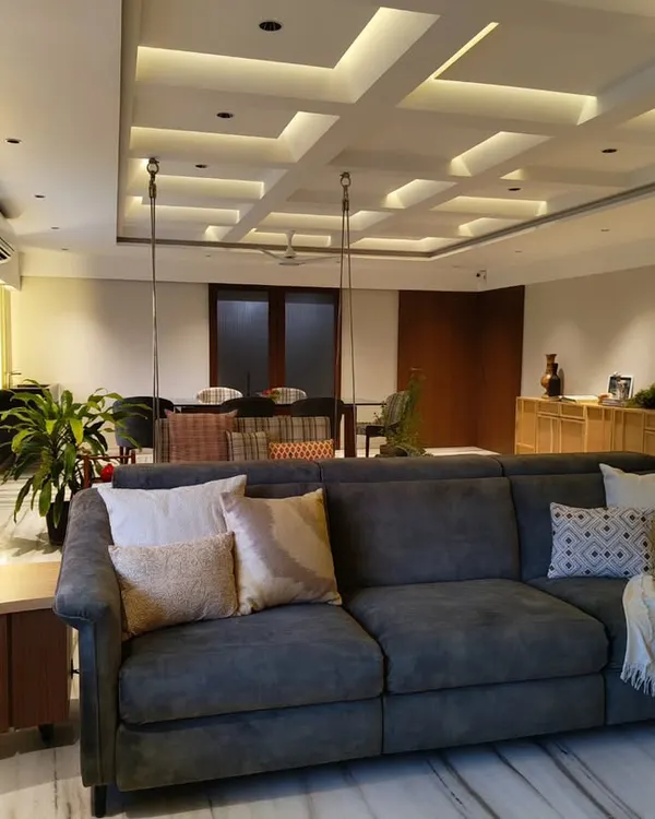 I call this the "hygge" corner. With its plush sofa, warm lighting, and cozy throws, it’s the perfect spot to curl up with a cup of hot chocolate on a rainy day.