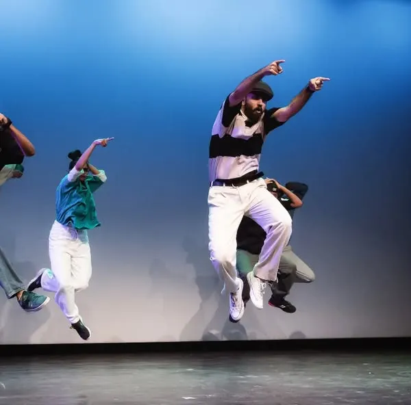 An action shot from a memorable performance night. This jump captures the explosive energy and synchronization I build into my group choreography for stage acts.