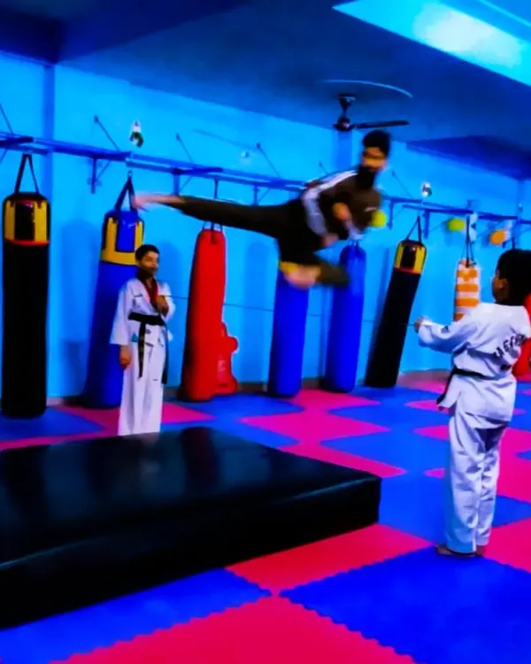 The body achieves what the mind believes. Here, one of my dedicated students demonstrates a flying side kick, a testament to the power of discipline and consistent martial arts training.