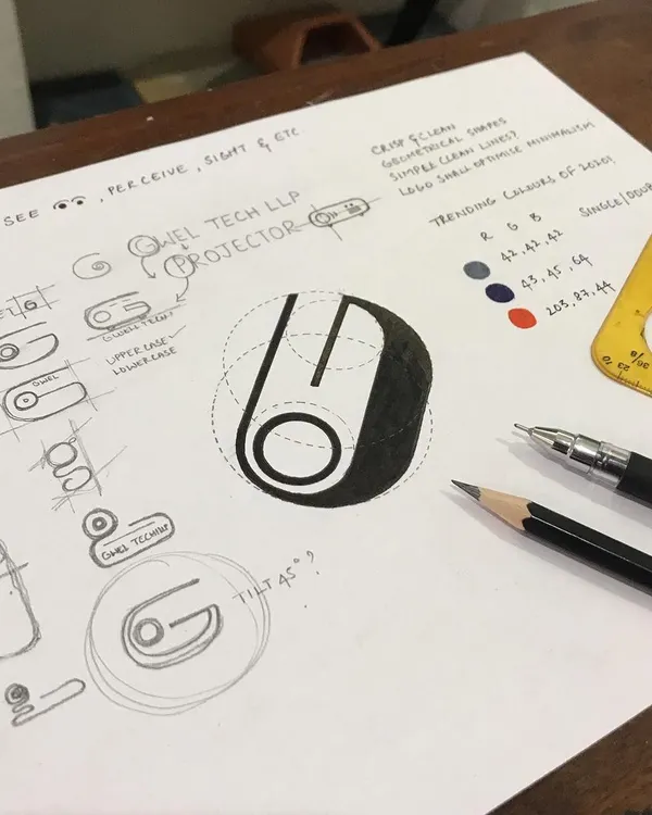 My design process begins with pencil and paper, not pixels. This image shows the initial brainstorming and geometric structuring for the Gwel Tech LLP logo, exploring how the letter 'G' could be visualized as a projector, moving from rough concepts to a refined, calculated form.