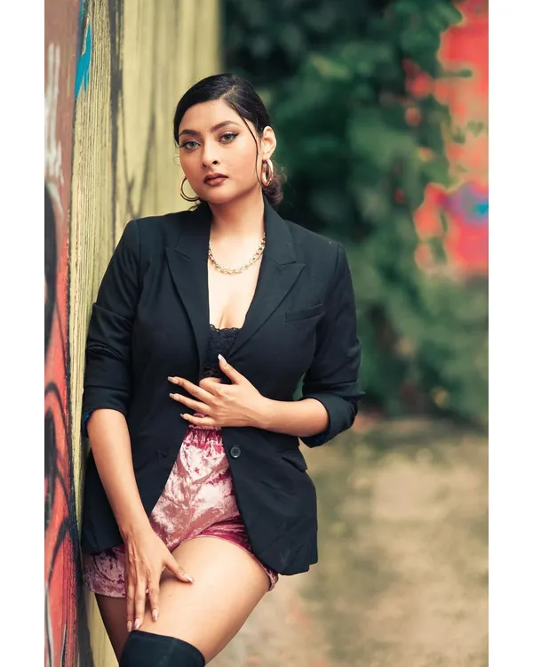 The lead shot for a 'BOSS LADY' social media campaign. This image establishes a strong, confident persona for the brand, blending power dressing with an edgy, urban environment.