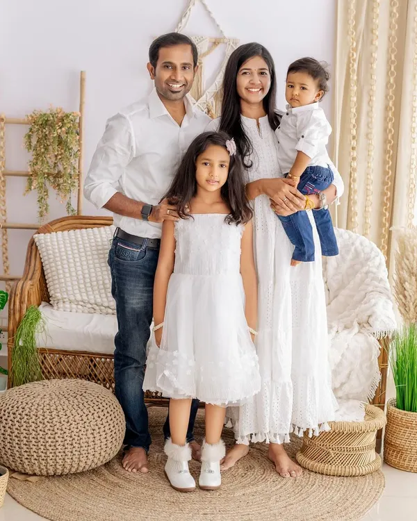 A beautiful family portrait in our natural light studio setup. We guide families into comfortable poses that feel genuine and show their connection.