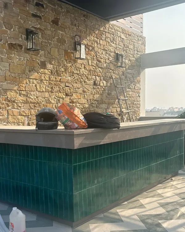Work lately. An outdoor bar taking shape with a stunning stone wall and emerald green tiles. We can't wait to see this space ready for entertaining.