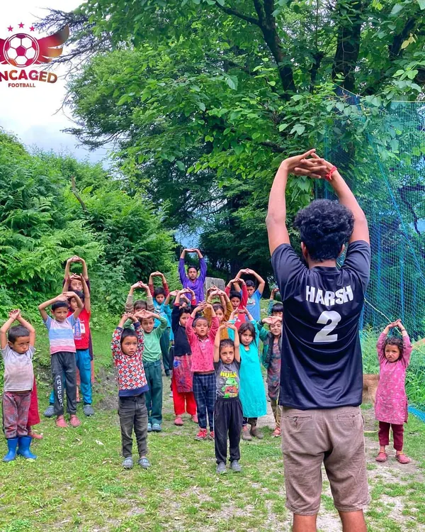 We start every session with energy and focus. Here, we are leading a morning warm-up and stretching session with the children of Grahan village, getting them ready for a day of learning football fundamentals in the beautiful Parvati Valley.