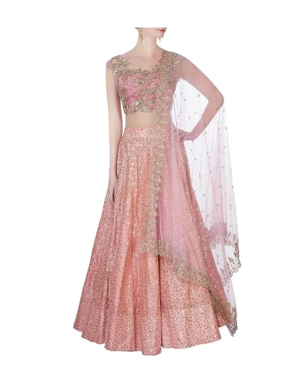This is a custom-stitched bridal lehenga with intricate sequin work, designed for a client's special day. I focus on creating a flattering silhouette with a perfectly fitted choli and a flowing skirt, ensuring the entire ensemble feels both grand and comfortable.