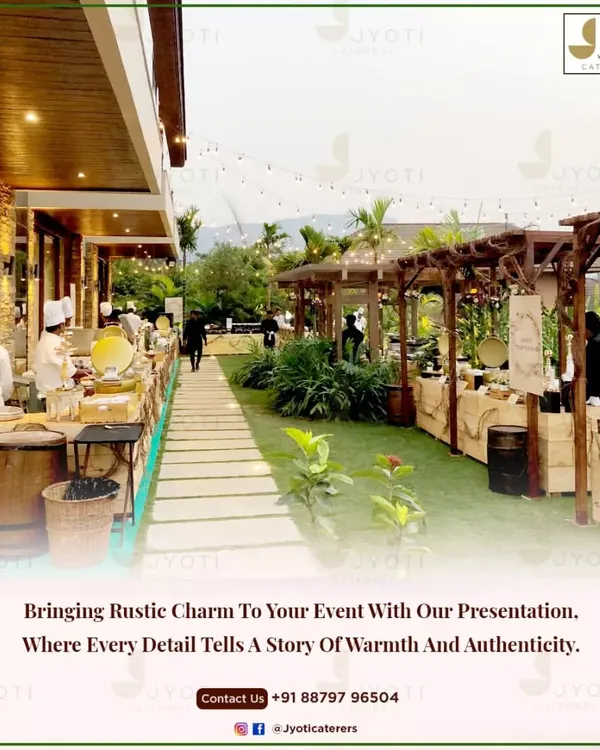 An outdoor event featuring rustic wooden counters and barrel tables, creating a warm and authentic atmosphere for guests to enjoy.