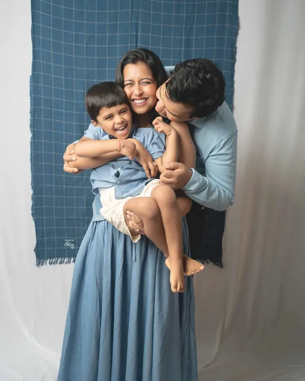 This is what pure, unscripted joy looks like. I love capturing the warmth of a family hug, where laughter is real and love fills the frame. This candid family portrait session in my Mumbai studio, with their coordinated blue outfits, resulted in a memory they will treasure forever.