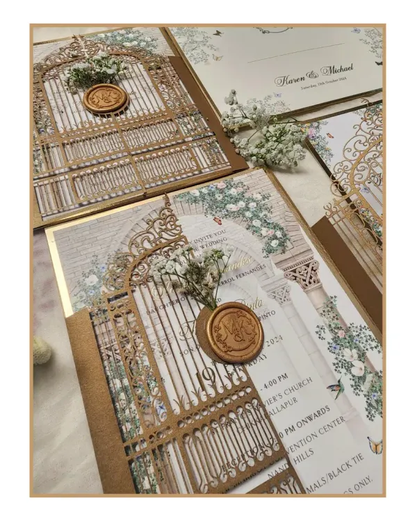 We call this our enchanted fairytale wedding suite. It features an intricate laser-cut gatefold, crafted from metallic board, that opens to reveal the invitation. The design is completed with a custom monogrammed wax seal and a delicate sprig of baby's breath, setting a truly magical tone.
