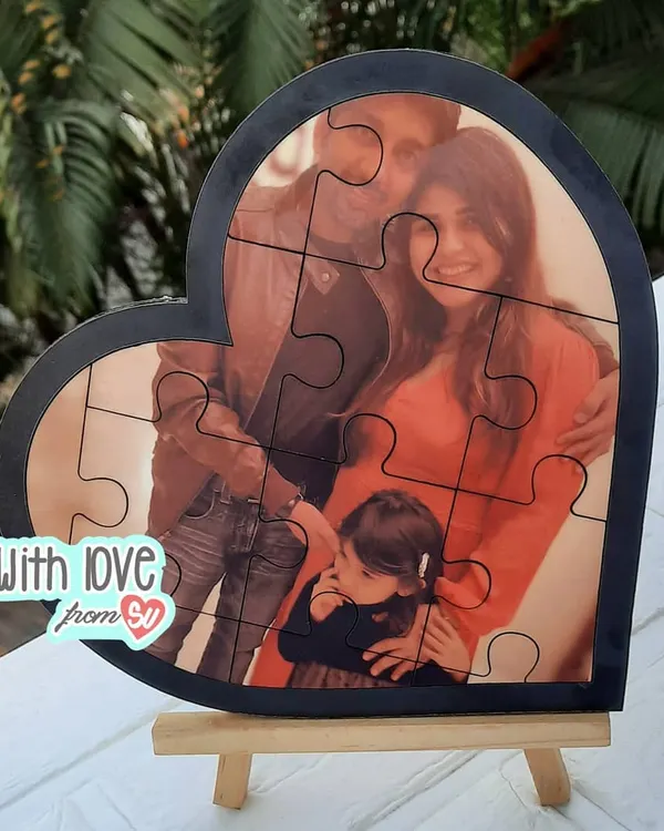This custom heart-shaped photo puzzle is more than just a game, it's a beautiful way to piece together a favorite family memory. It comes with a small wooden easel, making it a perfect piece of photo decor for a desk or shelf.