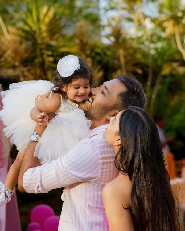 A moment of pure love and affection. We quietly observe and capture these candid interactions between parents and their children, as they are often the most powerful and emotional images from the day.