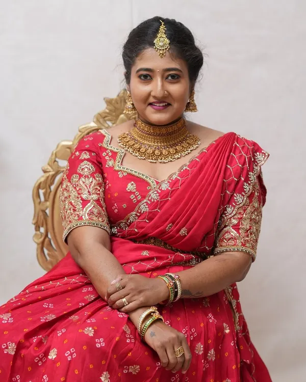 A happy client looking beautiful for her event. She rented this stunning antique gold choker set from our store in RR Nagar.