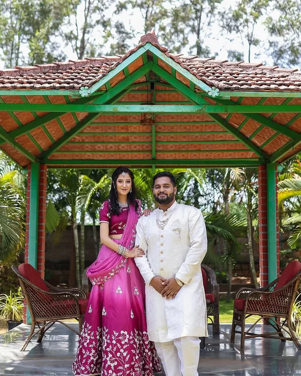 A picture-perfect couple at their engagement. For the bride, I created a lovely pink eyeshadow look to complement her vibrant lehenga, keeping the overall feel elegant and celebratory for their outdoor event.