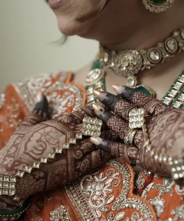 The perfect bridal stain. This is the deep, rich maroon color my organic henna achieves, beautifully complementing the bride's traditional jewelry and outfit.