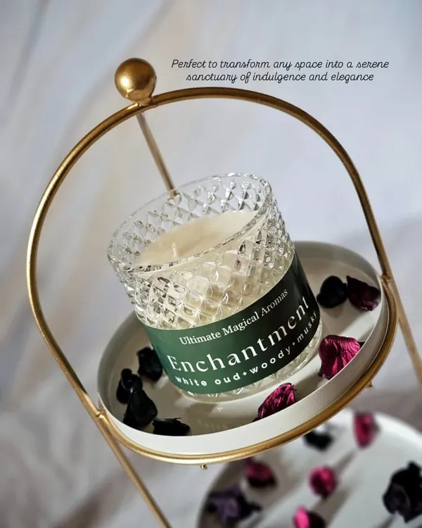 My 'Enchantment' Crystal Jar Candle, elegantly displayed. The white oud, woody, and musky notes of this fragrance are perfect for creating a serene sanctuary in your home.
