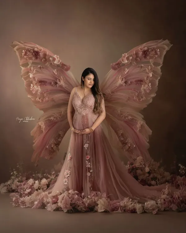 A portrait to celebrate the magical transformation of motherhood. I love creating these dreamy, fairytale-inspired scenes in my studio, using flowing fabrics and soft lighting to bring your vision to life.