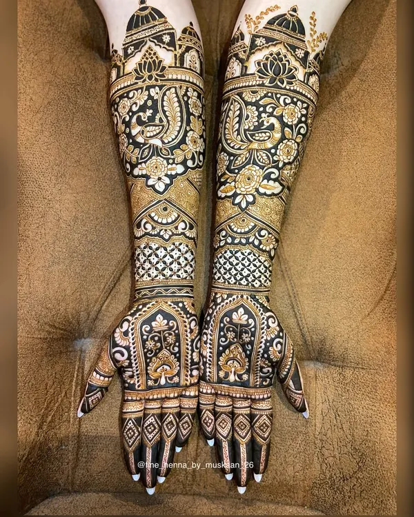 A stunning example of full coverage bridal henna. This design is packed with detail, featuring peacocks, florals, and traditional jaali (net) patterns for a rich and opulent look.