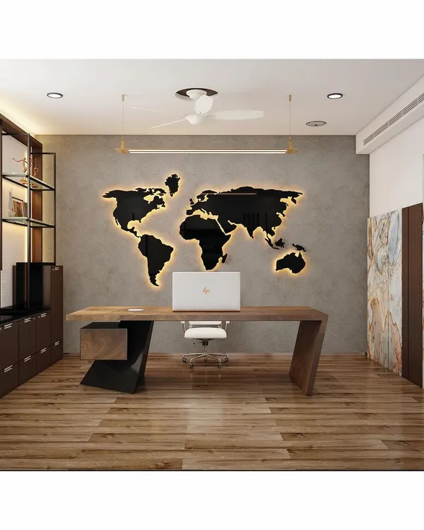 This director's cabin for SVG Exports in Bangalore exemplifies our approach to corporate interior design. The design features a bold, backlit world map, a custom-designed wooden desk, and a concrete-finish accent wall, creating a powerful and professional atmosphere for a global business leader.