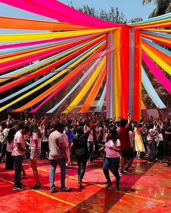 This is the kind of energy I bring to large-scale festival setups. For the 'Rang De' Holi bash at Dadar's BMC Ground, I created this massive overhead canopy with vibrant, multi-colored draping that covered the entire party area, making the event a huge success.