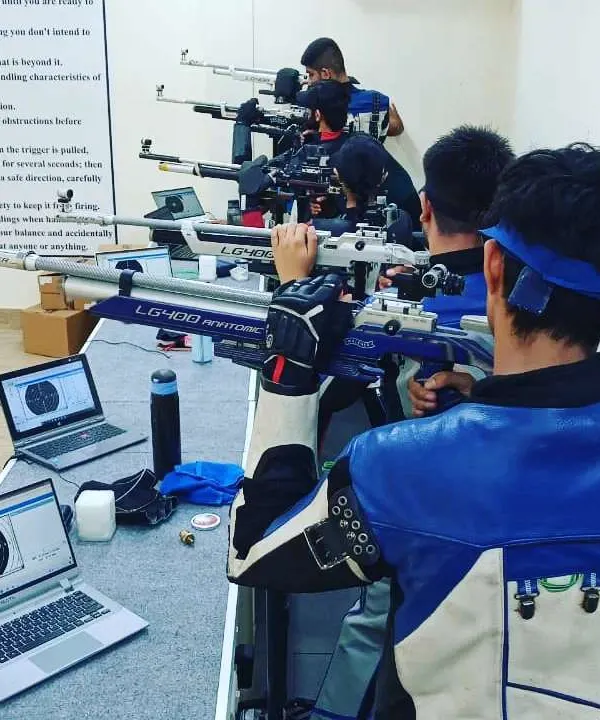 Our 10m air rifle shooters in a focused practice session. We use SIUS electronic targets, connected to individual laptops, to provide instant feedback and data analysis, which is crucial for competitive improvement.
