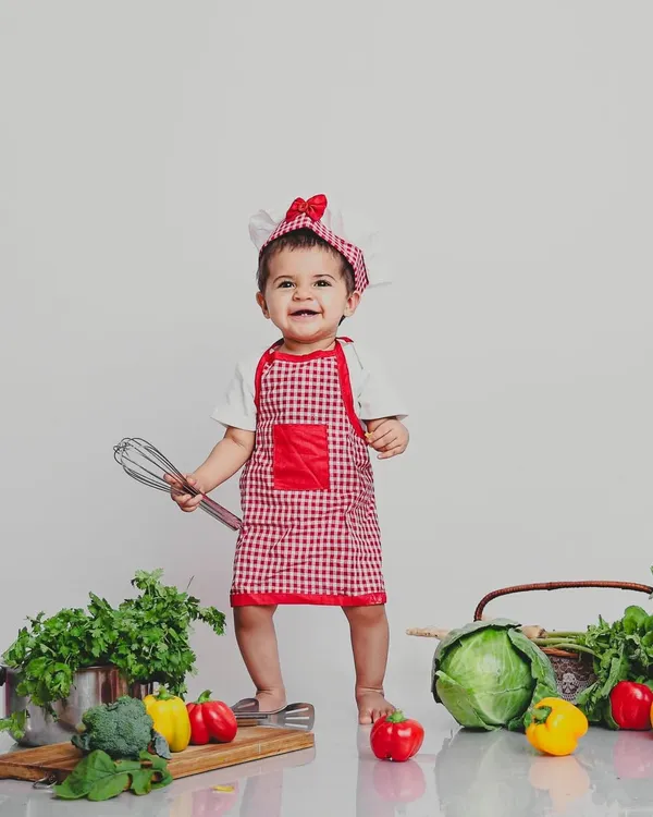 Whipping up some fun in the studio! This little chef theme is one of our favorites, using real vegetables and kitchen props for a playful and colorful photoshoot.