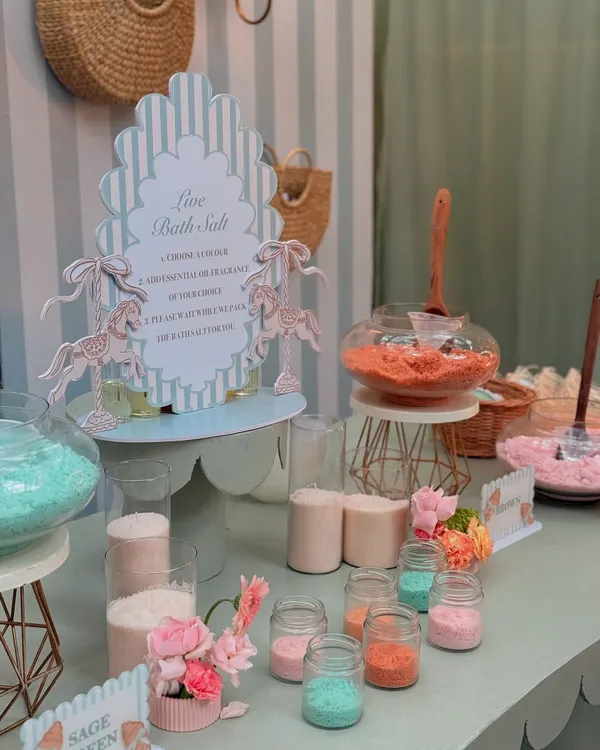 A "Live Bath Salt" station at the Parisian baby shower, where guests could create their own custom-scented bath salts as a unique and interactive party favor.