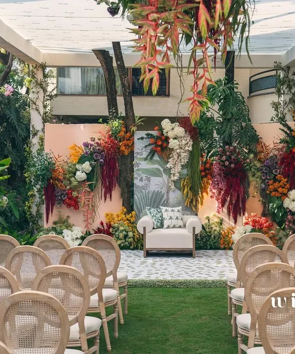 A full view of our 'Garden of Gaia' setup for a seemantha ceremony. The backyard was transformed with a stunning floral wall, creating a lush, vibrant, and celebratory space for the mom-to-be.