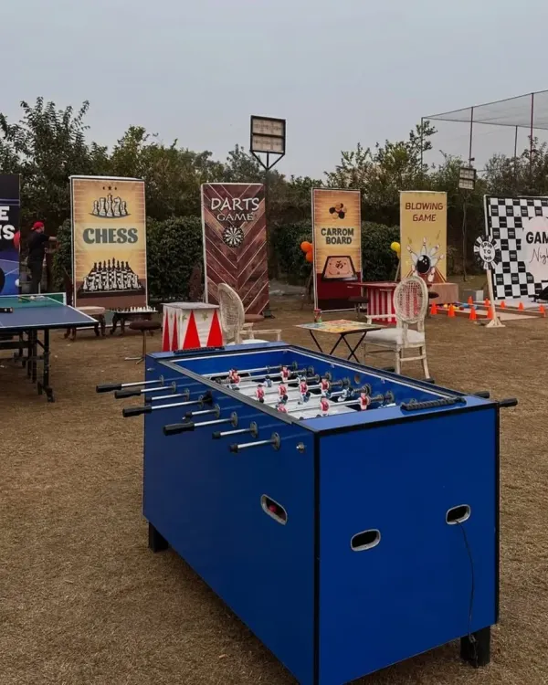 We can set up a complete game zone for your event. This outdoor arrangement for a pre-wedding party included table tennis, foosball, a carrom board, a chess station, and a darts game, offering something for everyone.