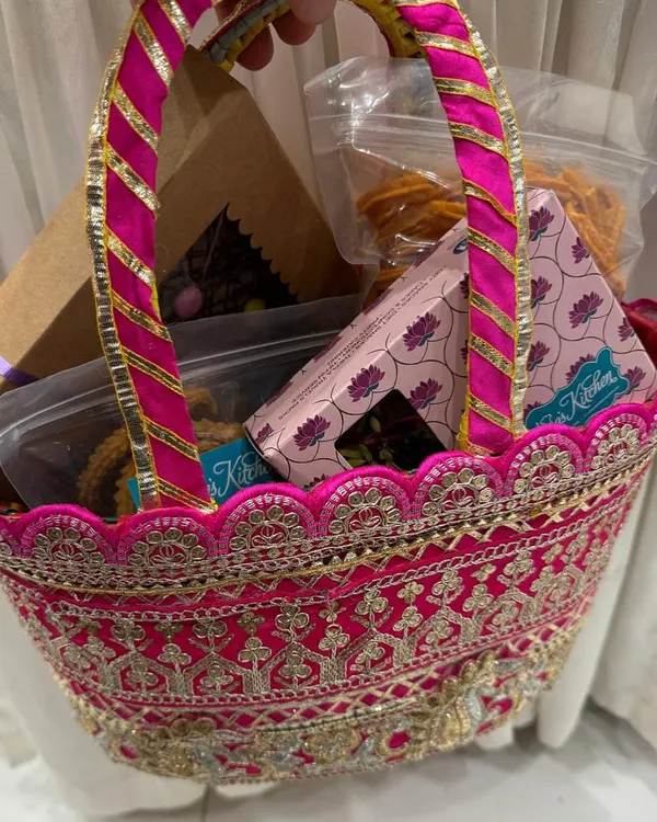 A beautiful pink embroidered basket filled with our homemade festive treats. You can curate your own hamper with your favorite snacks and sweets to gift to friends and family.