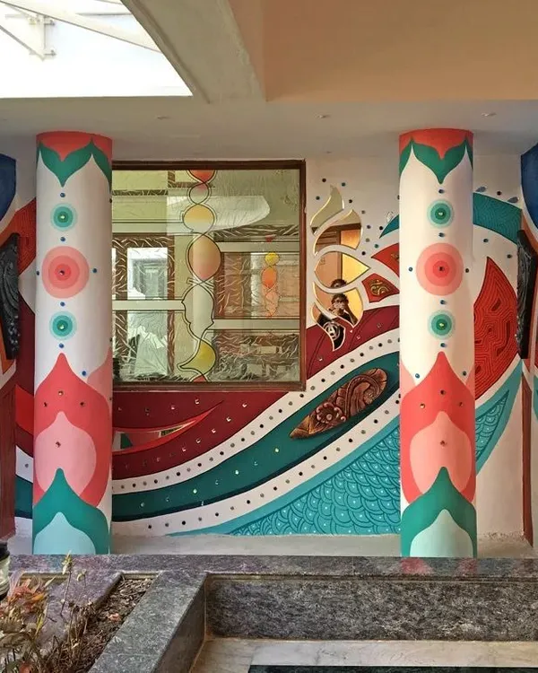 We transformed the entrance of this building with a vibrant, abstract mural covering the walls and pillars. This piece combines colorful geometric patterns with 3D sculpted elements to create a truly unique and immersive entryway.