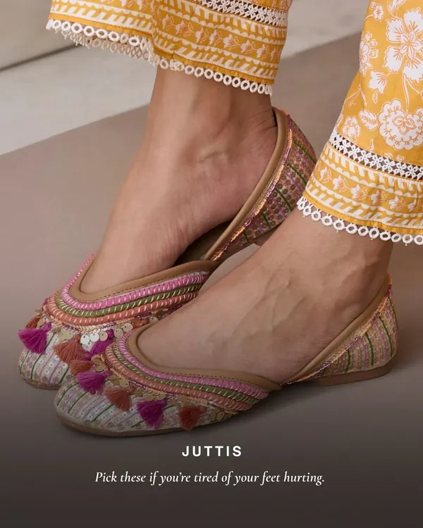If you're tired of your feet hurting, these are for you. This pair of juttis features colorful threadwork and fun tassels, adding a playful touch to your ethnic wear while promising all-day comfort.