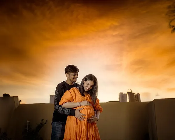 Sunsets, soulmates, and sweet little kicks. This stunning golden hour shot on a Mumbai rooftop captures the couple wrapped in warm light, a perfect metaphor for the warmth of their growing love.
