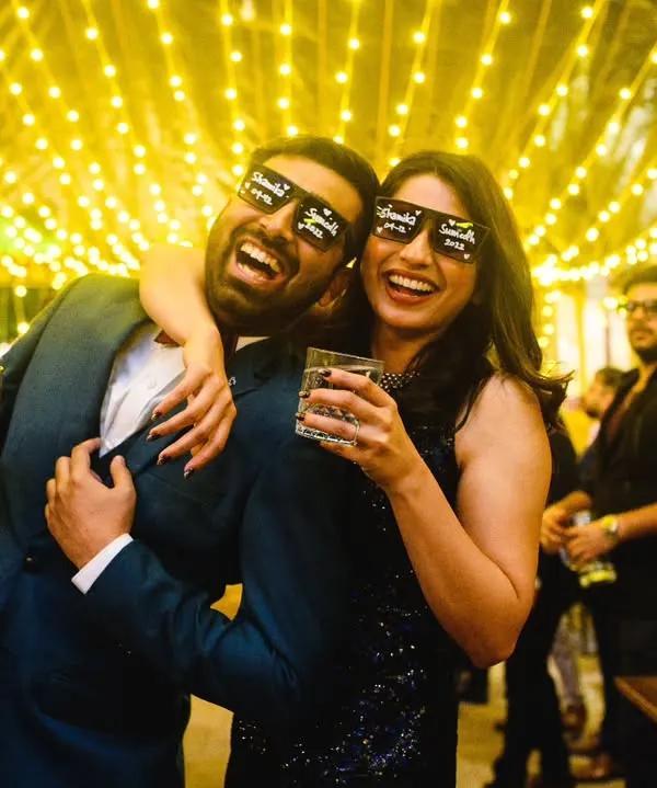 A totally mad cocktail party. Shamika and Sumedh, with their fun glasses and drinks in hand, were ready to party with their friends. The fairy lights and their energy made for some awesome photos.