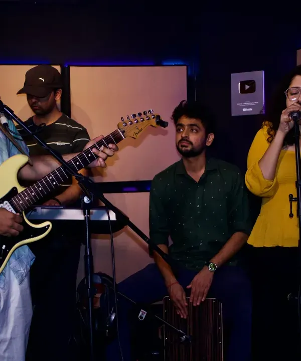 Collaboration is at the heart of our bootcamps. This is a snapshot of a jam session where students work together, combining guitar, vocals, and percussion to create music on the spot. It's a fantastic way to learn and connect with fellow musicians.