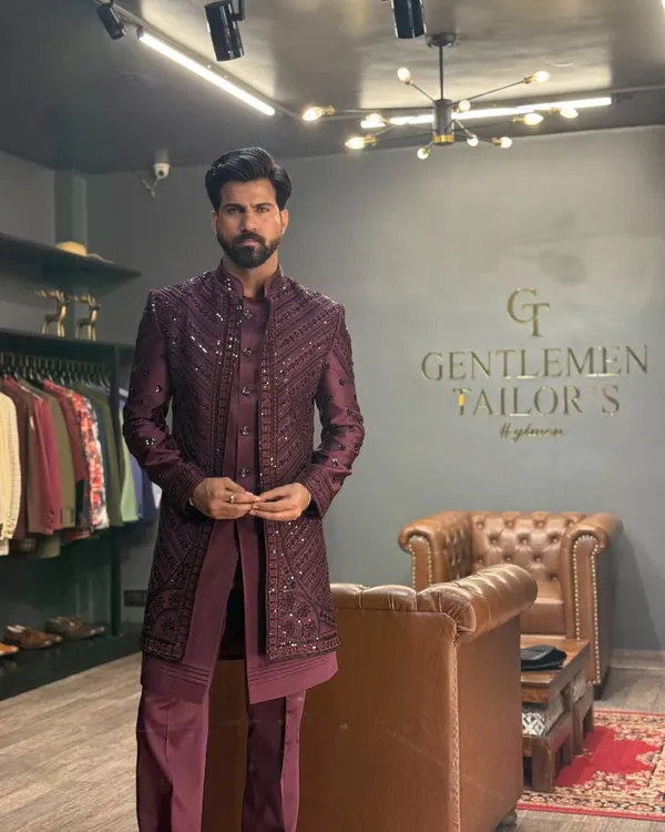 A full view of our three-piece Indo-western set in a rich wine hue. The detailed embroidery on the long jacket creates a stunning visual texture, perfect for a groom's reception look.