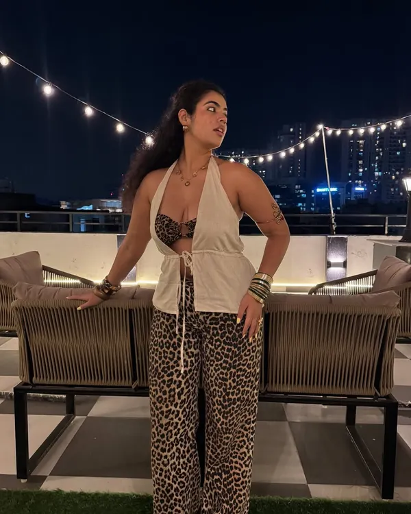 My favorite type of animal is me in animal print. This look is the definition of my style: bold, confident, and a little bit extra. I paired these statement leopard print pants with a thrifted linen top and a matching bandeau for a look that’s perfect for a night out.