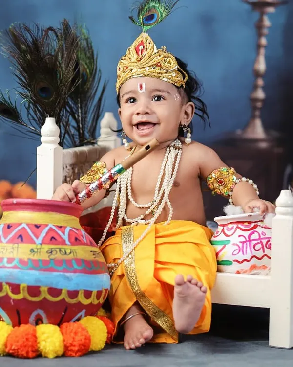 This is the kind of pure joy I love to capture. Dressing up your little one as Nanha Kanha, complete with a flute and a mischievous smile, is one of my favorite themes. It’s more than a photo; it’s a blessed memory.