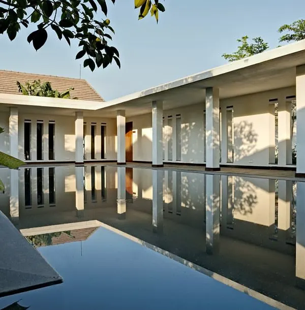 The spa complex at Club Mahindra's Lake Pawana resort is centered around this still expanse of water. The design creates a profound sense of serenity, with the architecture and its reflection merging to form a tranquil, meditative space.