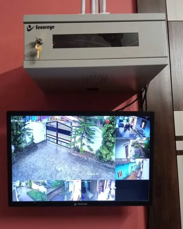 This is the peace of mind I deliver. A complete home surveillance system with a multi-camera display and a securely locked DVR rack, giving you full visibility and control over your property's safety.