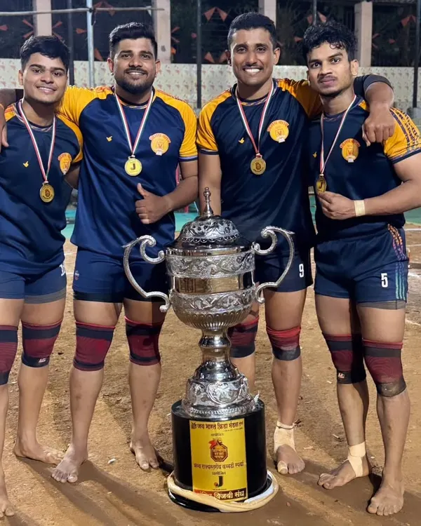 Our players proudly posing with their medals and the championship trophy. For us, senior players are more than coaches, they are big brothers.