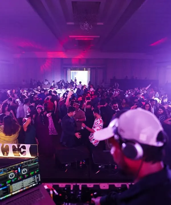 This is what it's all about. Me, my decks, and a massive crowd ready for a killer night. I love commanding the energy of a huge room and making sure every single person feels the beat.