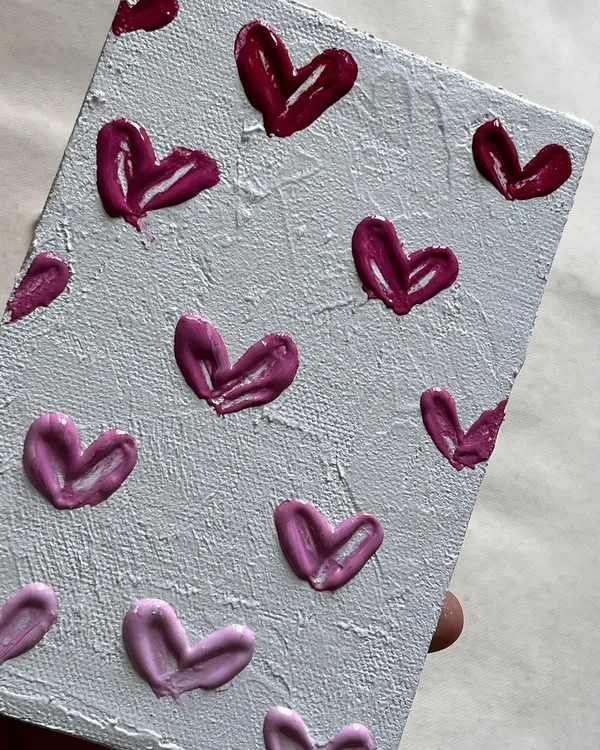 Texture painting is pure art therapy. The feeling of applying the paste and creating these little hearts on canvas is just amazing. You have to try it.