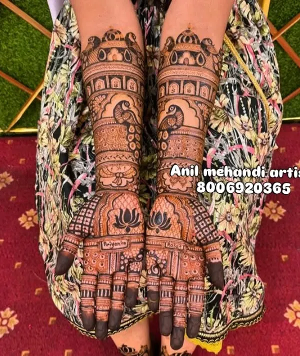 A classic full-hand bridal mehandi with royal motifs. This design features peacocks, lotus flowers, and palace-style architecture (jharokhas) for a truly regal look.