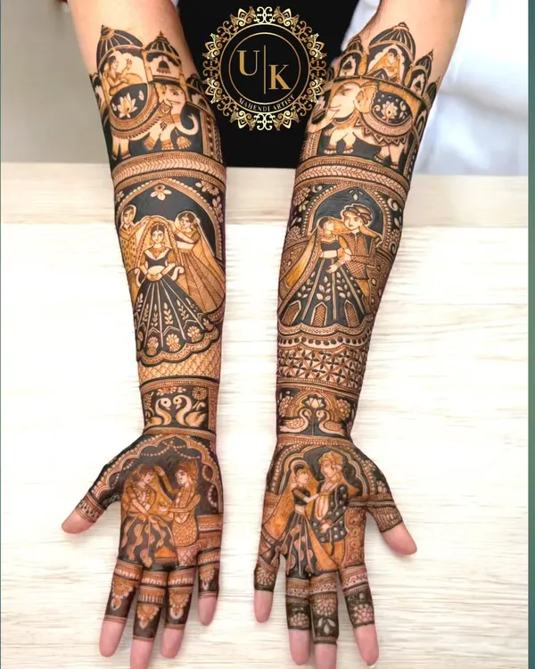 Portrait mehandi is my specialty. This design features incredibly detailed portraits of a couple, along with elephants and other traditional motifs, creating a truly personalized and royal bridal look.