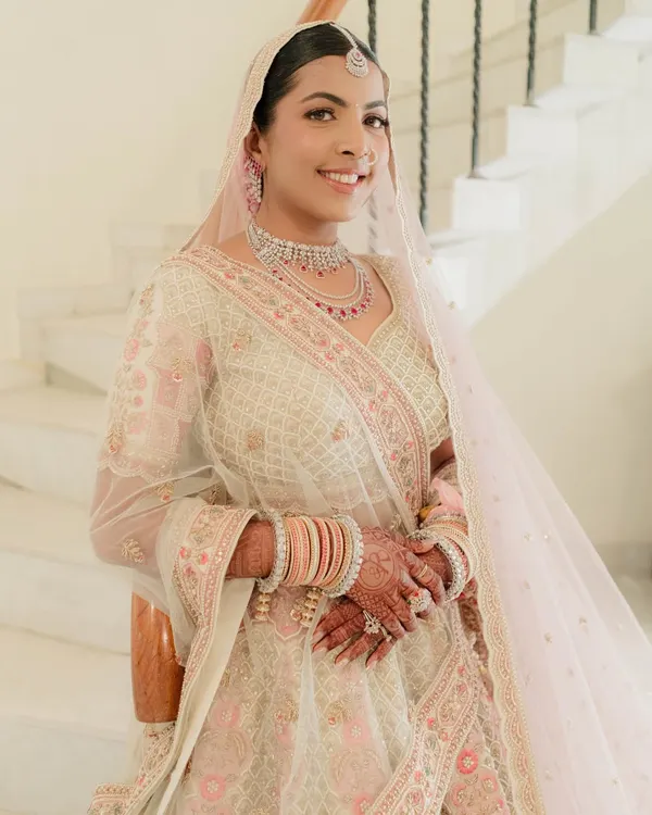 Nidhi looked like a dream for her morning pheras. We chose a soft pink and ivory palette for her makeup to complement her pastel lehenga, focusing on a fresh and luminous skin finish.
