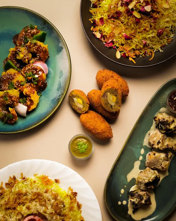 A glimpse of the feasts I create. This spread features some of my signature dishes, from flavorful biryanis and succulent kebabs to fresh starters. Each dish is prepared with authentic techniques and the freshest ingredients for a memorable culinary experience.