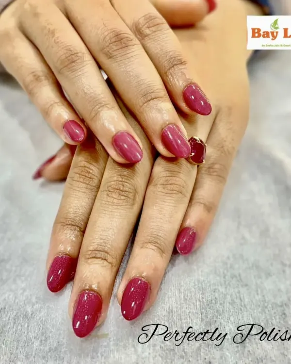 Sometimes, a single color is all you need for a perfectly polished look. Here are beautifully shaped almond nails with a flawless application of a rich, glossy magenta gel polish.