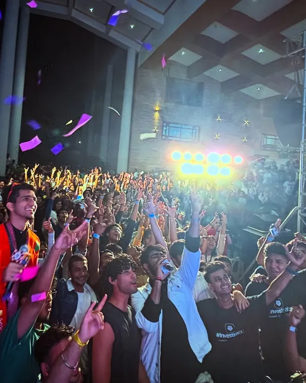 The moment the confetti drops during my set at the Under 25 Summit at Christ University. This is the peak energy I build towards, creating an explosive finale for the students.
