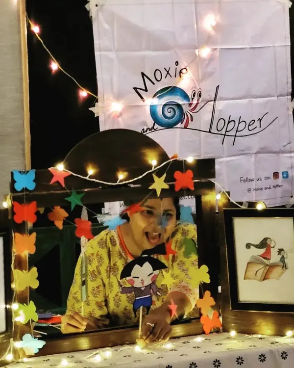 Peekaboo! Here I am using one of our handmade stick puppets to tell a story. These little characters are a huge hit with the kids and really help bring the narrative to life.