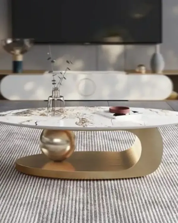 This is one of my signature center table designs, featuring a marble top that appears to be balanced on a sculptural golden base. It's a true conversation starter.
