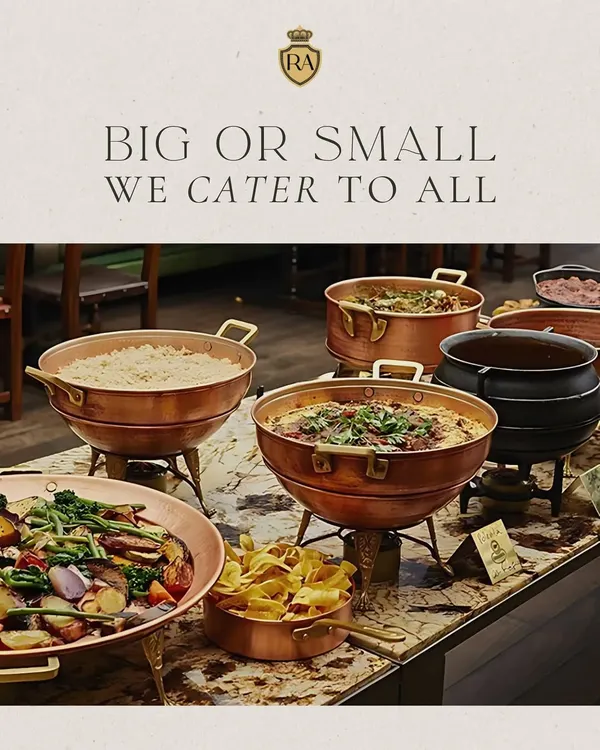 Big or small, I cater to all. This image shows a beautiful buffet line with a variety of main courses served in traditional copper and brass chafing dishes, suitable for any size of corporate gathering.